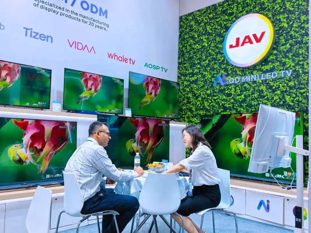 JAV team talking to customers in the JAV Booth at the 140th Canton Fair